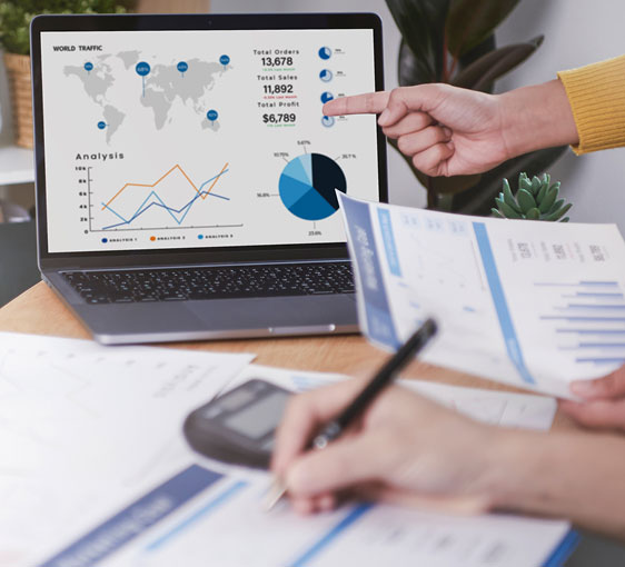 Laptop on the desk and taking notes